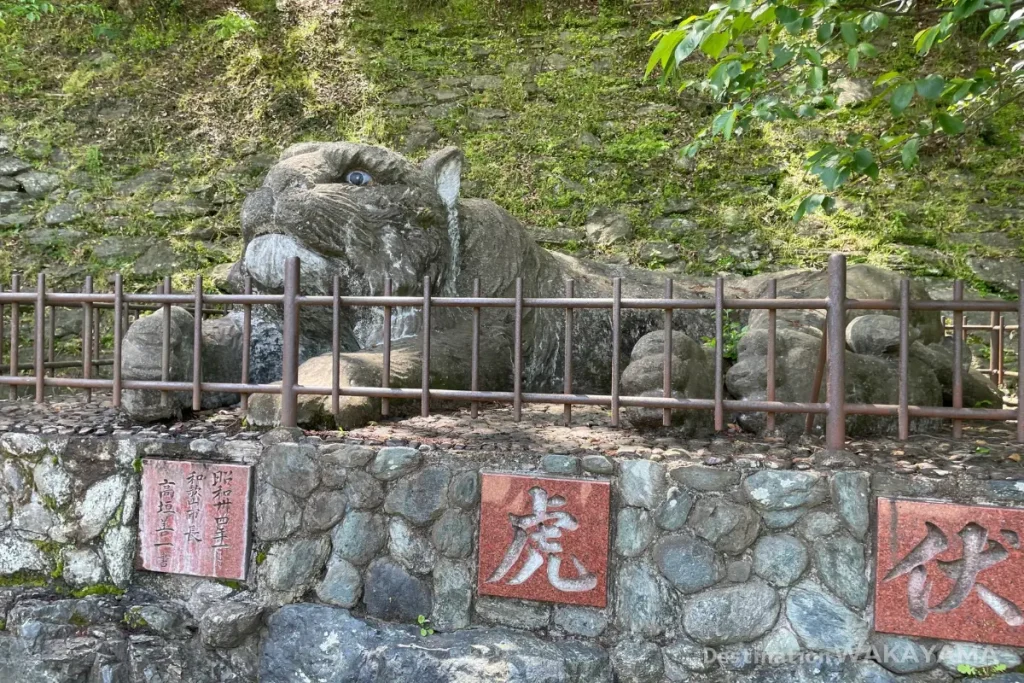 Statue of a crouching tiger made of stone